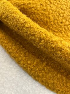 closeup of yellow fabric on white background