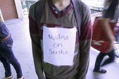 a man with a sign on his shirt that says mudist on serkke