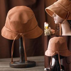 Stay stylish and protected with our rich brown bucket hat. Made from breathable cotton, it features a slightly flared brim for sun protection, an adjustable chin strap, and a decorative back tie for a secure and elegant fit. Foldable for easy storage, it's perfect for beach trips, hiking, and gardening. Enjoy comfort a Cheap Adjustable Summer Bucket Hat, Cotton Fedora Hat, Brown Cotton Sun Hat For Beach, Adjustable Brown Cotton Sun Hat, Brown Cotton Bucket Hat With Short Brim, Adjustable Cotton Sun Hat With Short Brim, Adjustable Short Brim Cotton Sun Hat, Brown Cotton Bucket Hat With Curved Brim, Adjustable Brown Bucket Sun Hat