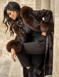 This astrakhan furry coat, in a dark brown color is truly one of a kind! A hard to find, unique piece ,is like nothing you've ever had as an outerwear! In a long, comfortable line ,with a fluffy fox collar and cuffs, embossed patterns, this piece will be the reason you want to stroll around on the cold winter days and nights! For dreamy, classy and sophisticated looks, this coat of incomparable quality , is a must have! Astrakhan fur coat with eye hook closures Front closure Concealed side pocke Leather Photoshoot, Astrakhan Coat, Luxury Fur Coat, Fur Coat Brown, Faux Fur Outfit, Fur Long Coat, Fox Collar, Fur Lined Coat, Long Fur Coat