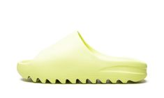 The adidas Yeezy Slide “Glow” is a September 2021 release of the slip-on sandal by Kanye West in a bold colorway.  Designed for comfort, and in this “Glow” style, drawing attention, the Yeezy Slide is an easy-wearing shoe from West’s ever-popular signature footwear line with adidas that excels in bringing a casual vibe to an outfit.  The model’s one-piece, lightweight EVA foam body is dipped in a neon green hue.  Subtle adidas Three Stripes branding appears on the top of the footbed.  The Yeezy Slide’s outsole features deep ridges that provide stability on slippery surfaces.  Release date: September 6, 2021 Adidas Yeezy Slide, Glow Green, Nike X Travis Scott, Converse Run, Yeezy Slides, Low Air Jordan 1, Adidas Three Stripes, Converse Run Star, Jordan 8