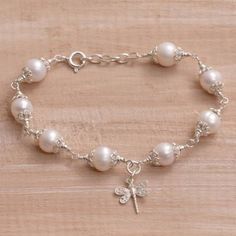 Cultured Pearl and Sterling Silver Dragonfly Charm Bracelet - Moonlight Dragonfly | NOVICA Aa Jewelry, Pearl Charm Bracelet, Material Art, Wrist Jewelry, Dragonfly Charm, Wire Jewelry Designs, Gelang Manik, Sterling Silver Charm Bracelet, Silver Charm Bracelet