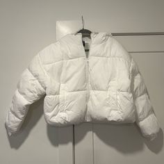 H&M White Puffer Jacket With Hood. Size L Never Worn But Opened Packaging. Shell - 100% Recycled Polyester Lining - 100% Recycled Polyester Padding - 100% Recycled Polyester White Oversized Outerwear With Adjustable Hood, Oversized White Puffer Outerwear, White Long Sleeve Outerwear With Adjustable Hood, Oversized White Puffer Jacket For Spring, White Oversized Casual Puffer Jacket, Casual Oversized White Puffer Jacket, White Spring Outerwear With Detachable Hood, Spring White Outerwear With Detachable Hood, Trendy H&m Winter Outerwear