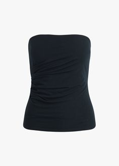 With pull-on styling and side ruching, The Colette Top is sure to be your new favorite tube top. Here's why–it's made from the most comfortable, super stretchy jersey so it's extra comfortable and forms to your curves for the most flattering fit. 93% Rayon, 7% Elastane Jersey Blend Gaby is 5'9" wearing size S. Versatile Stretch Ruched Tank Top, Black Seamless Top With 4-way Stretch, Black Seamless Tops With 4-way Stretch, Black Seamless 4-way Stretch Tops, Black Stretch Tube Top, Black Bandeau Tops In Elastane, Black Top With Ruched Back, Fitted Black Top With Ruched Back, Black Tops With Ruched Back For Summer