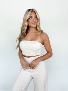 The Vacay Vibes Top is the epitome of vacation luxury. Its ultra-stretchy, smocked fabric and strapless, bandeau design is both stylishly chic and refined, making it perfect for elevated beach days or summer parties. A cropped fit and fashionable silhouette makes the Vacay Vibes Top an easy choice for any warm-weather wardrobe. Pair with the matching pant for the perfect summer ensemble. Self 70% Viscose 30% Linen Lining 100% Rayon Hand wash cold. Vacation Luxury, Trendy Boutique Clothing, Lane 201, Vacay Vibes, Strapless Bandeau, Summer Parties, Beach Days, Perfect Summer, Beach Day