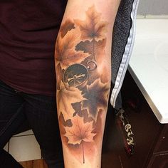 a man with a clock and maple leaves on his arm