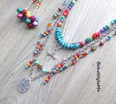 "Live Love Laugh, Boho Style Me Colorful Boho Beaded Layer Necklace, BohoStyleMe, Handmade Bohemian Pendant Necklace This boho colorful beaded necklace is full of happy, fun, mixed colors. A completely hand knotted strand runs along the silver chain, with playful dangles. The focal pendant is two-sided, front reads \"Live, Love, Laugh\", and the backside has a crystal studded etched flower. A delicate dragonfly charm is placed between the strands of beads, the top strand consisting of genuine turquoise and additional bright color glass beads. Silver is used throughout this whimsical boho necklace - enjoy! Length - 31 inches (longest), 25 inches (shortest) Please see all pictures for accurate colors. Created for you - my unique handcrafted jewelry is created individually in my personal desi Colorful Beaded Necklace, Unique Handcrafted Jewelry, Live Love Laugh, Dragonfly Charm, Hippie Necklace, Layer Necklace, Silver Chain Style, Genuine Turquoise, Beaded Necklaces