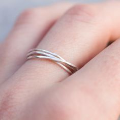 This delicate ring made of 4 tiny sterling silver bands is almost imperceptible on your hand. If you love minimalist and elegant jewelry, you'll love it! It perfectly matches any style and outfit. Each band is 0.8-0.9 mm thick and is relatively sturdy although the ring looks very dainty on the finger. Choose the metal for this ring - sterling silver or 9k gold. You see the ring of the 5.5 size in the pictures. You may order the ring of any size. If you are not sure about the size, this might be Delicate Everyday Stackable Rings, Modern Twist Adjustable Sterling Silver Midi Rings, Minimalist Double Band Stackable Rings As Gift, Adjustable Sterling Silver Midi Rings With A Modern Twist, Gift Stackable Double Band Rings With A Modern Twist, Gift Midi Rings With A Modern Twist, Adjustable Dainty Stackable Rings, Silver Double Band Stackable Dainty Rings, Silver Dainty Double Band Stackable Rings