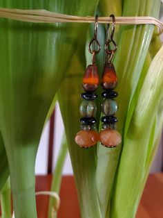 Genuine Carnelian Orange and Green Czech Earrings Bohemian Earrings - Dangle Boho Earrings - Boho Jewelry - Bohemian Jewelry   Handmade. Color variation with stones.  Nickel free. Bohemian Orange Teardrop Jewelry, Vintage Teardrop Earrings With Natural Stones, Vintage Teardrop Natural Stone Earrings, Bohemian Orange Czech Glass Earrings, Vintage Multicolor Czech Glass Earrings, Multicolor Earthy Dangle Earrings, Earthy Multicolor Dangle Earrings, Bohemian Multicolor Czech Glass Earrings, Handmade Teardrop Earthy Earrings