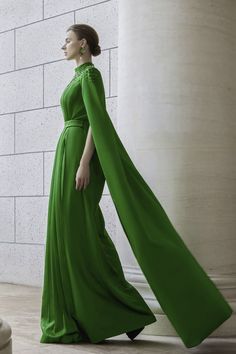 Featuring a stunning floor length design, the dress is a must-have for any formal occasion. Made with luxurious silk and tailored with pleats, this dress exudes elegance and sophistication. Perfect for making a statement and turning heads at any event. Elegant Green A-line Gown, Elegant Green A-line Evening Dress, Pre-draped Silk A-line Evening Dress, Pre-draped Cocktail Evening Dress With Pleated Back, Elegant Floor-length Green Gown, Luxury A-line Dress For Banquet, Pre-draped Silk Evening Dress With Pleated Back, Full-length Gown With Pleated Bodice For Party, Pre-draped Evening Dress With Pleated Back For Party