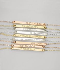 A simple yet beautiful way to commemorate a special day or moment in time with this Roman numeral dainty bar necklace. Perfect for wedding date, engagement, first date, or any other anniversary. ✭ Character limit of 20 on each side. Please note this necklace is not eligible for a return or refund. ✭ Bar is 3mm x 40mm. Model is wearing 16 inch necklace. - - - - - - - - - - EVERYTHING is customizable! METAL OPTIONS ✦ 14K yellow gold filled ✦ 14K rose gold filled ✦ 925 Sterling Silver CHAIN LENGTH Personalized Bar Necklace For Anniversary, Silver Custom Name Bar Necklace For Anniversary, Minimalist White Name Necklace For Anniversary, Minimalist Rose Gold Bar Necklace For Anniversary, Customizable Gold Bar Necklace For Anniversary, Silver Bar Necklace For Anniversary, Elegant Custom Name Bar Necklace For Anniversary, Minimalist Bar Necklace For Anniversary Or Mother's Day, Classic Silver Bar Necklace For Anniversary