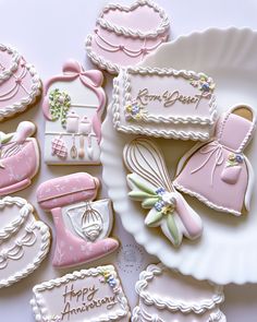 some decorated cookies are sitting on a plate