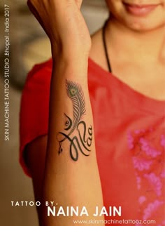 a woman with a tattoo on her arm