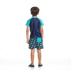 Roar into summer with this fierce and fun dinosaur graphic set for your little explorer! Featuring a raglan rashguard and coordinating boardshorts, your toddler will be ready for any adventure under the sun. The raglan design offers extra sun protection while the playful dinosaur print adds a touch of excitement. Made with comfortable and durable fabric, this set is perfect for beach days, pool parties, and everything in between. Get your hands on this must-have outfit for your little one today! Casual Rash Guard With Uv Protection For Playwear, Playful Outdoor Swimwear With Upf 50+, Playful Swim Trunks With Upf 50+, Playful Upf 50+ Swim Trunks For Playwear, Casual Summer Rash Guard For Playwear, Casual Short Sleeve Rash Guard For Beach, Playful Outdoor Swimwear With Uv Protection, Playful Swimwear With Uv Protection For Outdoor, Summer Rash Guard With Upf 50+ For Playwear