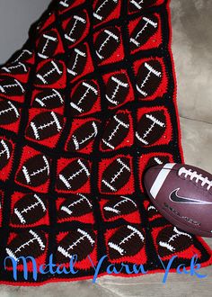 a knitted afghan with a football on it