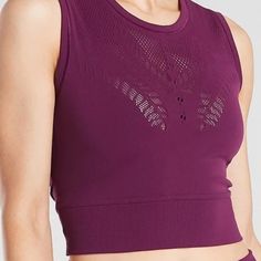 Pretty Plum Workout Top, Nwt And In Perfect Condition. Chafe-Free Seamless Fabric Stretches With Movement, And Delicate, Open Hole Mesh Provides Airflow. Fitted, Crop Length. Length: 15.5" 81% Nylon, 19% Spandex Machine Wash And Dry Breathable Purple Tops For Sports, Seamless Racerback Athleisure Top, Athleisure Seamless Racerback Top, Purple Sportswear Tops For Training, Purple Sportswear Training Top, Sporty Seamless Sleeveless Top, Purple Tank Top For Workout, Purple Sleeveless Gym Tops, Seamless Sleeveless Athleisure Top