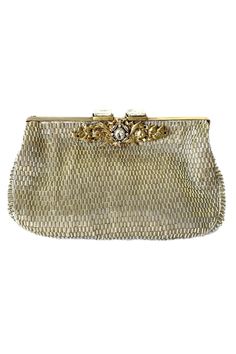 Silver clutch hand embroidered with micro glass beads and embellished with a solid brass handcast piece and vintage diamante clasp.
Type: Embellished, Hand Embroidered
Composition: Solid Hand Cast Brass, Lining: Silk
Color: Silver
Other Details: 
Removable shoulder chain
Quilted silk lining
Measurement: L x W (in inches): 8 x 5
 - Aza Fashions Antique Gold Embroidered Bags, Designer Hand Embellished Gold Clutch, Gold Hand-embellished Clutch For Evening, Hand Embellished Gold Clutch For Evening, Gold Hand Embellished Clutch For Evening, Designer Gold Hand Embellished Clutch, Designer Embellished Formal Bags, Chic Hand Embellished Formal Bags, Glamorous Embroidered Formal Bag