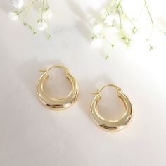 Mia 24mm Dome Earrings boast a classic design with a subtle 24mm diameter--the perfect addition to any outfit. Crafted from high-quality Jewelers brass and accented with a thick 18k gold finish, these earrings are a must have for your everyday style. Enjoy all-day comfort with a secure and lightweight clasp.   * 18k Gold Filled   * 24mm Diameter   * Nickle, Lead and Cadmium Free   * Earrings are Final Sale Classic Earrings With Polished Finish, Classic Gold-plated Hoop Earrings, Classic Gold Plated Pierced Hoop Earrings, Classic Gold Earrings With Polished Finish, Gold Hoop Earrings With Shiny Finish For Formal Occasions, Classic Gold Polished Earrings, Formal Gold Hoop Earrings With Shiny Finish, Everyday Round Gold-plated Earrings, Gold Round Earrings For Everyday