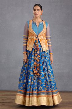 Persian blue anarkali with all-over digital Bhagalpuri print, gota patti trims on the bodice and sheer full length sleeves. Comes with floral embroidered orange short jacket.
Components:2
Pattern:Embroidery and Print
Type of Work:Digital Bhagalpuri Print, Hand Adda Work and Gota
Neckline:Notch
Sleeve Type:Anarkali: Long and Jacket Sleeveless
Fabric:Slub Silk
Color:Blue,Orange
Other Details:
Jacket with tie up front
Sheer sleeves with lace trims on the elbows
Cutout back jacket
Closure: Anarkali: