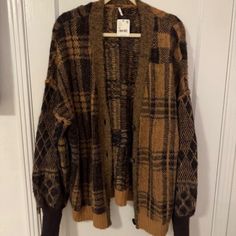 Free People Cardigan Sweater. Size Is Medium, But It's A Very Oversized Fit. Fabric Is Super Warm And Soft. Would Be Cute With A Tank Top Underneath And Have The Sweater Be Worn Hanging Off Your Shoulder. Oversized Plaid Casual Cardigan, Oversized Button-up Cardigan For Fall, Oversized Casual Plaid Cardigan, Casual Oversized Plaid Cardigan, Oversized Brown Cardigan For Fall, Oversized Plaid Long Sleeve Cardigan, Oversized Plaid Winter Cardigan, Oversized Plaid Cardigan For Winter, Oversized Plaid Sweater For Fall