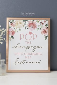 a sign that says pop the champagne she's changing her last name