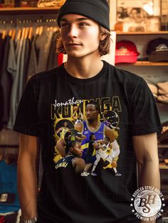 "This 90s bootleg style rap t-shirt featuring Jonathan Kuminga playing for Oakland was created by a team of designers who are passionate about basketball, fashion, and streetwear. Our shirts are inspired by 1990s bootleg culture where street artists created popular unofficial merchandise featuring rappers and other artists. Each shirt features bold designs that give it that authentic retro feel. If you love 90s bootleg style rap shirts, basketball, and streetwear, it's time to take your wardrobe Black Short Sleeve Throwback T-shirt, Black Throwback T-shirt For Sports Events, Throwback Black Pre-shrunk T-shirt, 90s Style T-shirt With Sublimation Print For Streetwear, 90s Style Sublimation Print T-shirt For Streetwear, Urban T-shirt With Screen Print For Sports Events, Throwback Streetwear T-shirt, Pre-shrunk, Urban Style Graphic T-shirt For Sports Events, Urban Style Screen Print T-shirt For Sports Events