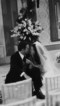 a bride and groom sitting next to each other