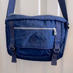 Kipling Messenger Bag/Satchel. Looks Like A Cool Messenger Bag Or Satchel. Color Is True Blue To Darker Blue In Shade Straps Are Material. Used Once. Looks Brand New. 12”Long X 91/2” H Excellent Condition. Messenger Bag Kipling, Blue Shoulder Bag With Zipper Pocket For School, Blue Satchel Shoulder Bag With Pockets, Blue Satchel With Zipper Pocket For School, Blue School Satchel With Zipper Pocket, Versatile Blue Shoulder Bag With Pockets, Versatile Blue Pouch Bag, Versatile Blue Satchel Bag, Blue Pouch Satchel For School