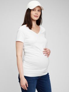 Soft knit with stretch.  V-neck.  Short sleeves.  Shirred details along sides for more belly room.  Please note: Maternity styles cannot be returned in store.  Please enjoy free returns by mail.  Made with 95% organically grown cotton.  Organic cotton is better for people and the environment because it's grown without the use of harmful synthetic pesticides and fertilizers. Maternity Vintage, Maternity Styles, Navy Uniforms, Gap Maternity, Pre Pregnancy, Pesticides, Maternity Fashion, Soft Knits, Vintage Tshirts