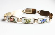 Sterling Silver Mixed Flowers Enamel Bracelet by diamentdesigns Heirloom Enamel Jewelry With Engraving, Heirloom Engraved Enamel Jewelry, Heirloom Enamel Engraved Jewelry, Antique White Bracelet Jewelry, White Antique Bracelet Jewelry, Antique Enamel Bracelets For Formal Occasions, Antique Enamel Bracelet For Formal Occasions, White Antique Bracelet, Antique Enamel Bracelet Jewelry