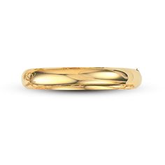 This timeless solid gold bangle bracelet stacks well with several bracelets or stands out alone. Fashioned in 14K yellow gold, the 7-inch bracelet is 10mm in width and secures in place with a snap-lock clasp. Stackable Gold Bracelet For Formal Occasions, Gold Bangle With Thick Band For Formal Occasions, Gold Thick Band Bracelet For Formal Occasions, Gold Thick Band Bracelets For Formal Occasions, Formal Gold Bracelet With Thick Band, 14k Yellow Gold Round Band Bracelet, Classic Gold Round Band Bracelet, Formal Yellow Gold Bracelet With Round Band, Formal Yellow Gold Round Band Bracelet