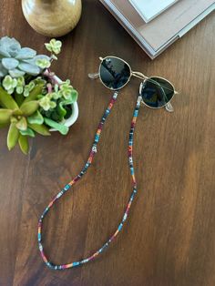 [BACK IN STOCK!] Boho Chic Sunglasses Chain in more than 20 styles! Show off your unique style with these practical and colorful Sunglasses cord.   ◆ Adjustable Rubber Holders to keep cord in place and glasses secure! ◆ Flat, 26" Length ◆ Nylon / Cotton blend ◆ Easy attachment, fits ALL glasses! ◆ Perfect for Sunglasses or Reading Glasses ◆ Comfortable and cool!  ◆ Inti is Proudly Canadian! Perfect for everyday wear, yoga, working-out, reading, hiking, rock climbing or just enjoying life while l Multicolor Glass Sunglasses For Festivals, Adjustable Multicolor Sunglasses For Beach, Multicolor Glass Sunglasses As Gift, Adjustable Glasses Chains For Festival, Adjustable Glass Sunglasses As Gift, Colorful Sunglasses, Sunglasses Cord, Glasses Chains, Sunglasses Chain