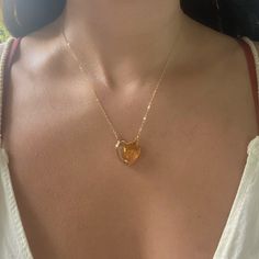 Beautiful AAA Large Citrine Heart Necklaces. 24k gold plated around the edges of the pendant so you can soak in the citrine energy through your skin Choose from 16 or 18 length! Chains are gold fill. Citrine attracts wealth, prosperity and success. It imparts joy, wonder, delight and enthusiasm. Raises self-esteem and self-confidence. Stimulates the brain, strengthening the intellect. Citrine promotes motivation, activates creativity and encourages self-expression Gold Pendant Heart Necklace With Gemstone, Gold Dainty Crystal Necklace For Healing, Gold Heart Necklace With Gemstone For Anniversary, Gold Crystal Necklace For Valentine's Day Gift, Valentine's Day Gold Crystal Necklace Gift, Valentine's Day Gift Gold Crystal Necklace, Gold Citrine Necklace For Healing, Gold Citrine Spiritual Necklace, Spiritual Gold Crystal Necklace For Anniversary