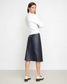 A sleek, asymmetric midi cut from soft vegan leather — Alba is the perfect staple you'll reach for season after season. We love to style this skirt with a cozy sweater and tall boots for a chic winter look. See below for our general Size Guide and available measurements Self made of 100% polyurethane, lining made of 100% polyester Machine wash cold and tumble dry low Versatile Workwear Skirt For Fall, Fall Versatile Relaxed Fit Skirt, Fall Business Casual Midi Skirt, Sleek Midi Skirt For Fall, Sleek Asymmetrical Workwear Skirt, Modern Office Skirt For Fall, Winter Leather Midi Skirt, Chic Flared Skirt For Fall, Business Casual Knee-length Fall Skirt