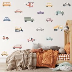 a child's bedroom with cars and trucks wall decals on the walls,