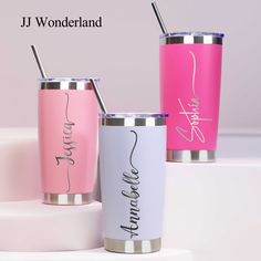 three different colored tumblers with names on them