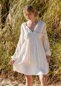 Our classic bohemian mini dress features an ultra-flowy and roomy silhouette, perfect for warmer weather. With a pretty floral embroidered yoke and sleeve detail. We love to style this effortless mini dress with a lace-up sandal and simple gold jewelry. Simple Gold Jewelry, Bohemian Mini Dress, Church Clothes, Embroidered Mini Dress, Blush Rose, Belted Shirt Dress, Church Outfits, Easter Dress, Ribbed Tank Tops