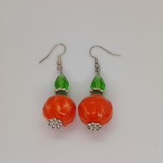 Handmade Pumpkin And Green Crystal Earrings Orange Beaded Earrings As A Gift, Nickel Free Orange Earrings For Gift, Nickel-free Orange Earrings For Gift, Handmade Orange Dangle Earrings, Orange Earrings With Ear Wire For Gift, Pumpkin Earrings, Green Crystal, Green Crystals, Green Orange