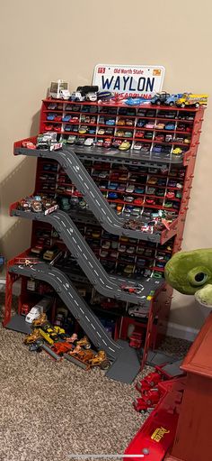 there is a toy car display in the room