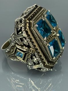 Embrace the allure of the past with our Mystic Aqua Blue Silver Ring. This striking piece is a nod to vintage sophistication, designed to stand out as a bold statement. Artisan-crafted with attention to detail, it features an enchanting green stone at its heart, complemented by intricate sterling silver work. We offer free ring resizing service for our rings, all you need to do is leaving message after you complete your payment. Material=  925 Sterling Silver   Stone/Stones=Aquamarine Ring Size( Vintage Sterling Silver Signet Ring For Wedding, Victorian Silver Signet Ring For Formal Occasions, Antique Sterling Silver Signet Ring, Vintage Sterling Silver Signet Ring For Formal Events, Vintage Sterling Silver Signet Ring For Formal Occasions, Antique Sterling Silver Signet Ring For Formal Occasions, Silver Rings With Historical Design As Gift, Silver Rings With Historical Design For Gifts, Antique Sterling Silver Signet Ring For Ceremonial Occasions