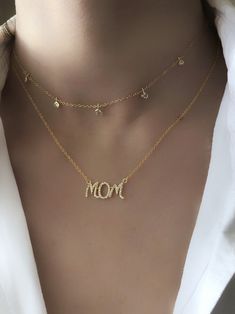 "IMPORTANT!! PLEASE LEAVE YOUR TELEPHONE NUMBER AS A NOTE AT CHECKOUT AS IT'S REQUIRED BY DHL IN ORDER TO BE ABLE TO CONTACT YOU AND SCHEDULE DELIVERY! * 24k gold filled MOM necklace featuring clear CZ stones * All the metallic parts are 24k gold filled (chain, charm, clasp & spring ring) * Length : 16\" (comes with a 1.5\" chain extension so you can adjust the length yourself) * The perfect gift for any Mom! * All of our items come beautifully gift wrapped, perfect as a gift to anyone! * Fo Personalized Cubic Zirconia Necklace For Mom, Personalized Cubic Zirconia Necklace For Mother's Day, Mother's Day Gift Cubic Zirconia Jewelry For Mom, Dainty Gold Name Necklace With Diamond, Dainty Diamond Name Necklace In Gold, Dainty Gold Diamond Name Necklace, Everyday Personalized Cubic Zirconia Necklaces, Gold Diamond Name Necklace, Gold Plated Charm Necklaces For Mother's Day