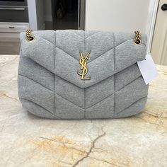 100% Authentic Ysl Medium Puffer Chain Bag In Jersey. Never Carried New With Tags. Color Is Gris Chine. Beautiful Bag Can Be Worn Double Trapped Or Crossbody. Hardware Is A Bronze Gold. This Is Part Of The New Collection. Bags Ysl, Grey Sweats, Saint Laurent Bags, Grey Bag, Yves Saint Laurent Bags, Bronze Gold, Chain Bag, Chain Bags, Beautiful Bags