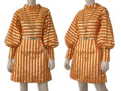 "This ultra mod 60s-era dress features a bold orange, yellow, and metallic gold striped print cotton fabric, high collar, voluminous balloon sleeves with long cuffs, fitted waist, and mini-length skirt. Dress is fully lined and zips up the back. Styling is very Twiggy-esque. Feels like a polished cotton fabric and could benefit from a good pressing, which I only fully realized after checking out my photographs. Best fits size xs or small (please refer to measurements below). Accessories not incl Twiggy Fashion, Twiggy Dress, Mini Rock, Swinging 60s, Balloon Skirt, 60s And 70s Fashion, Mod 60s, Balloon Sleeve Dress, 60s Mod