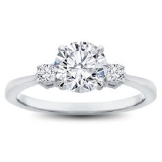 an engagement ring with three stones on the side