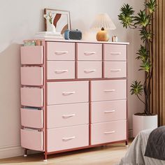 a pink chest of drawers in a bedroom