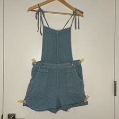 Never Worn No Flaws Tie Strings (Over Shoulder), All Usually Pockets, Button Enclosure On Sides, Raw Hem High Rise Summer Overalls With Pockets, High Rise Denim Blue Overalls For Summer, High Waist Denim Shortalls For Spring, High Rise Cotton Overalls, Denim Shortalls For Day Out, Spring Day Out Denim Overalls, Spring Denim Overalls For Day Out, Spring High Rise Denim Blue Overalls, Spring Light Wash Overalls For Day Out