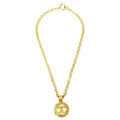 This authentic fabulous Chanel chunky gold plated hammered medallion chain necklace has the interlocking CC's. It is from the 1984. It is hallmarked Chanel "84 A Made In France. This makes a statement once worn. It is long of 15.5" H/ L and the medallion is 2" W. Each side of the link is 0.5" W. This has wonderful presence on. Quite fabulous! Looks great with a simple t shirt or more dressy clothes. Casual wear to night time wear and all season wear. Very chic yet classic Chanel. 22k Gold Chain Necklace, Vintage Chain Necklace, Simple T Shirt, Bracelet Love, Gold Link Chain, Clothes Casual, Wrap Necklaces, Long Chain Necklace, White Gold Necklaces