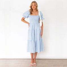 Feel as fresh as a daisy in this sassy Marianne Gingham Midi Dress! Perfect for any style for summer time with our retro to bohemian classic gingham patterns, it comes in two delicious candy/pastel colors that look good enough to eat. Shirring Bodice with adorable square neckline and puff sleeves with draw string tie at the back. Dress it up or dress it down - this dress is sure to turn heads! Wear off the shoulder for when you want more! Gender: WOMEN Item Type: Dresses Style: Bohemian Sleeve S Gingham Midi Dress, Candy Pastel, Fresh As A Daisy, Chic Dressing, Dresses Style, Folk Dresses, Polyester Dress, Style Crush, Blue Check