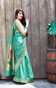 This Saree is Ready to Wear (With Fall and Pico Done). A designer saree in Sea Green Color. It has intricate design all over the saree. This saree is a suitable amalgamation of style and grace that is required from an ethnic wear. The saree is ideal for any formal gathering. The saree comes with an unstitched blouse of corresponding color and design as shown in the picture. Banarasi Silk Designer Sea Green Color Saree Fabric Type: Soft Banarasi SilkPrimary Colour: Sea GreenSecondary Colour(s): Golden Saree Length: 6.3 meters including 0.8 meter blouseBlouse Material: Matching Silk (Same as picture)Washing Instructions: Dry Clean Only Diwali Meenakari Pre-draped Saree In Dola Silk, Designer Paithani Silk Pre-draped Saree For Festivals, Bollywood Style Jamawar Pre-draped Saree For Diwali, Eid Art Silk Pre-draped Saree With Pallu, Banarasi Silk Pre-draped Saree With Zari Weaving, Pre-draped Katan Silk Saree For Navratri, Diwali Pre-draped Saree With Zari Weaving, Eid Festive Paithani Silk Pre-draped Saree, Designer Green Pre-draped Saree With Meenakari