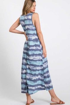 Rock a bold and playful look in our Blue Tye Dye Maxi Dress! This crew neck dress features a unique multi tie dye print with stripes in varying shades of blue, as well as a convenient front pocket. Made with a blend of soft and stretchy materials, this maxi dress is comfortable and stylish. Proudly made in the USA. TIE DYE BLUES STRIPE PRINT SLEEVELESS MAXI DRESS WITH FRONT POCKET63% RAYON 30% POLYESTER 5% SPANDEX Tye Dye Maxi Dress, Blue Tye Dye, Crew Neck Dress, Crewneck Dress, Rock A, Blue Tie Dye, Blue Ties, Tie Dye Print, Sleeveless Maxi Dress